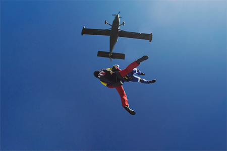 Freeflying skydivers in blue sky