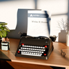 Retro typewriter with a piece of paper with LINC Home study Logo