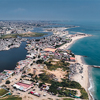An aerial perspective reveals the coastal with contrasting urban structures and waterfront developme