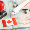 Approved Stamp visa and passport with Canada flag document to immigration at airport in country