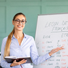 Confident female tutor teaching French