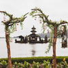 Wedding ceremony at Ulun Danu Bratan temple in Bali. Decorated with wood, flowers and vintage lamps