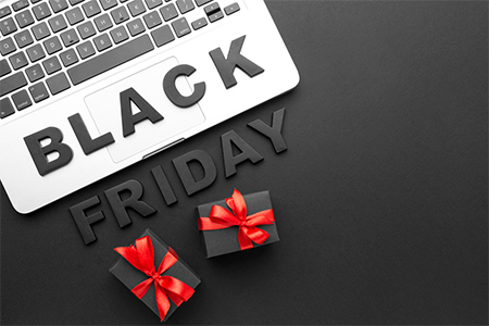 concept - black friday assortment on black background