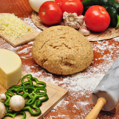 Recipes - Image of grated cheese on board with dough and whole tomato