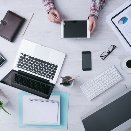 Various electronic devices on a desk top 