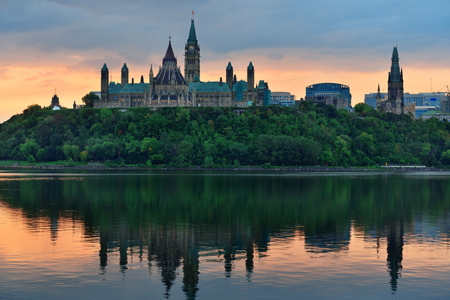 Ottawa city skyline at sunrise in the morning over river with urban historical buildings