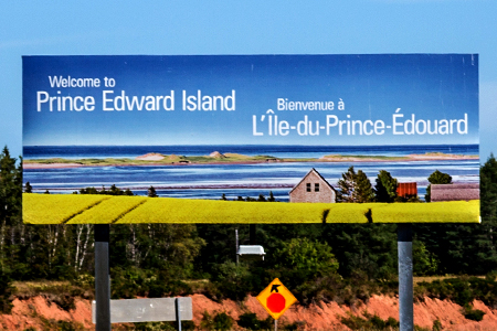 A sign welcomes visitors to Prince Edward Island at the Northumberland Ferries ferry terminal in Woo