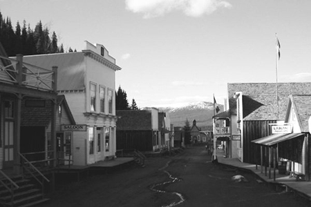 	 Barkerville's main street, taken in June 2004, showing the historic buildings and a small stream o