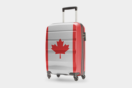 carry-on luggage with canada flag print