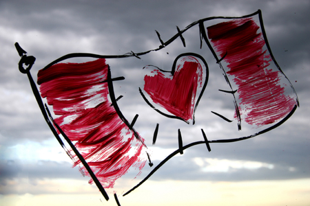 drawn canada flag with centre heart over cloudy sky