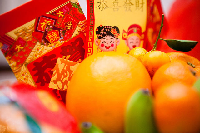 Chinese new year - good health and good fortune envelopes and fruit