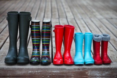 Five pairs of a colorful rain boots. Family concept