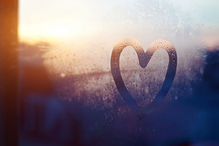 heart painted on frozen glass window