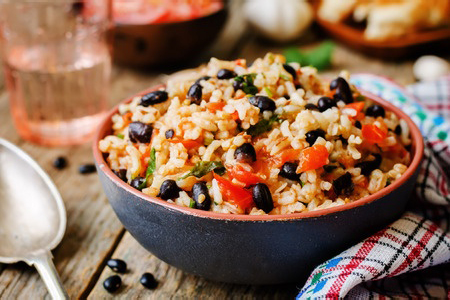 Mexican tomato black beans rice with cilantro. the toning. selective focus