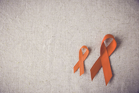 Orange Ribbons on toning background,Multiple sclerosis awareness