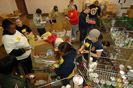 Volunteers sorting food donations