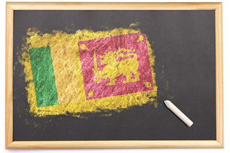 Blackboard with the national flag of Sri Lanka drawn on and a chalk.