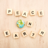 top view of cubes with peace on earth lettering