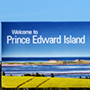 A sign welcomes visitors to Prince Edward Island at the Northumberland Ferries ferry terminal in Woo