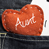 Aunt I love you! written on a piece of paper and a heart on a jeans