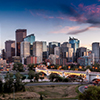 Calgary skyline at night with Bow River and Centre Street Bridge