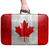 holding suitcase with canada flag