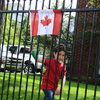 Young boy waving Canada flag