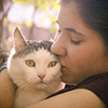summer sunny photo of teenager girl hugging cat close up outdoor photo