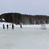 Teens skating on frozen lake