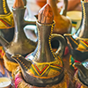 Traditional pottery jebena boiling pots for the coffee ceremony are decorated with colored patterns
