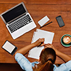 Top View Of Student Woman Using Laptop Computer, Notebook, Taking Notes At Cafe Table. 