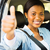 learner driver with instructor giving thumb up