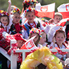  The Polish Constitution Day Parade, Children on a float wearing traditional polish clothing, waving