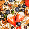 Ingredients for cooking healthy breakfast in shape of heart. Strawberries, blueberries, nuts, oat fl