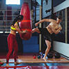 Boxer practicing a kick boxing in fitness studio