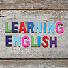 Learning English text with colourful letters scattered