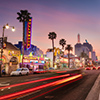 Traffic on Hollywood Boulevard at dusk. The theater district is famous tourist attraction.