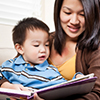 A portrait of a mother and a son reading a book (asian, reading, toddler)