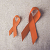 Orange Ribbons on toning background,Multiple sclerosis awareness