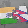puzzle with the national flag of india and nepal on a world map background. 