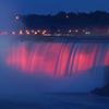 Niagara falls lit up at night
