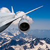 plane flying over the snow-capped mountains airplane flying down against the sky landing or crash of