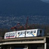 Vancouver Skytrain in front of mountains