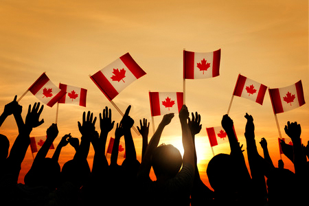 Group of People Waving Canadian Flag